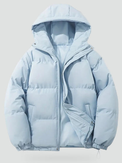 Hellblaue Pufferjacke liegend mit geöffnetem Reißverschluss